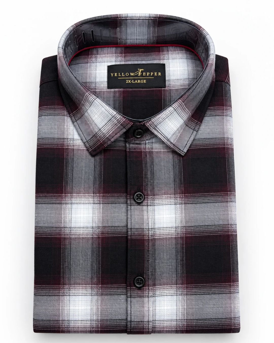 A folded long-sleeve plaid dress shirt in gray, black, and burgundy, with a visible neck label reading 'Yellow River Extra Large'.