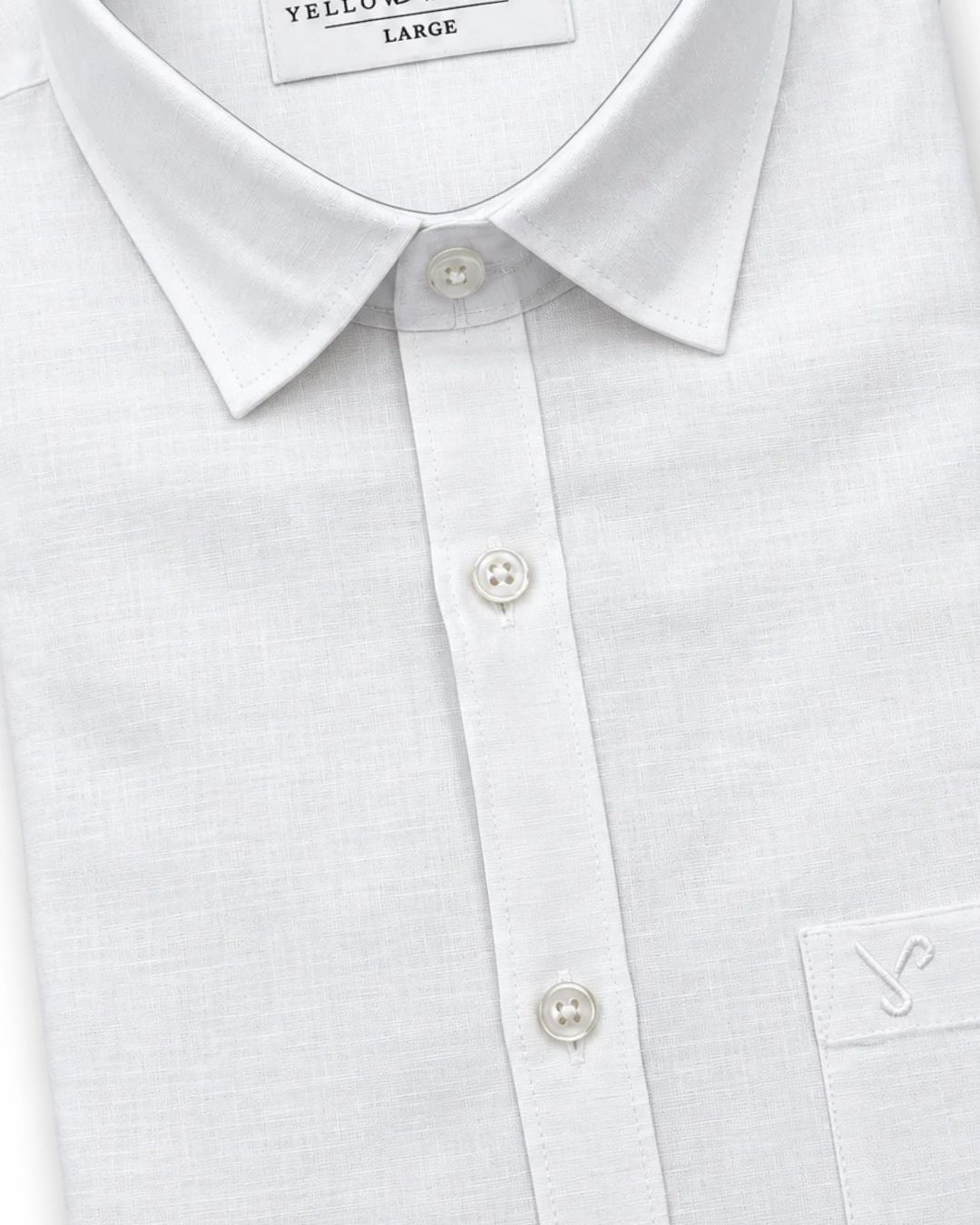 Close-up of a white long-sleeve button-down shirt with a pointed collar, white buttons, and a chest pocket featuring a small embroidered logo.