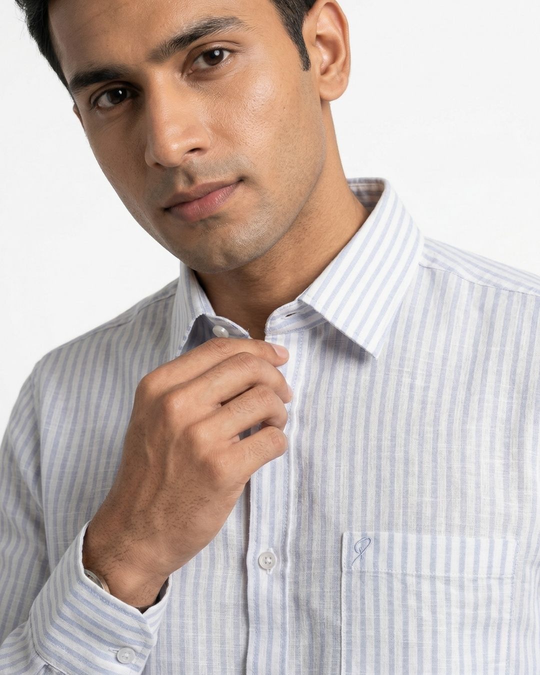 Man wearing a striped shirt against a white background