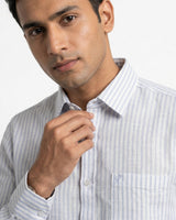 Man wearing a striped shirt against a white background