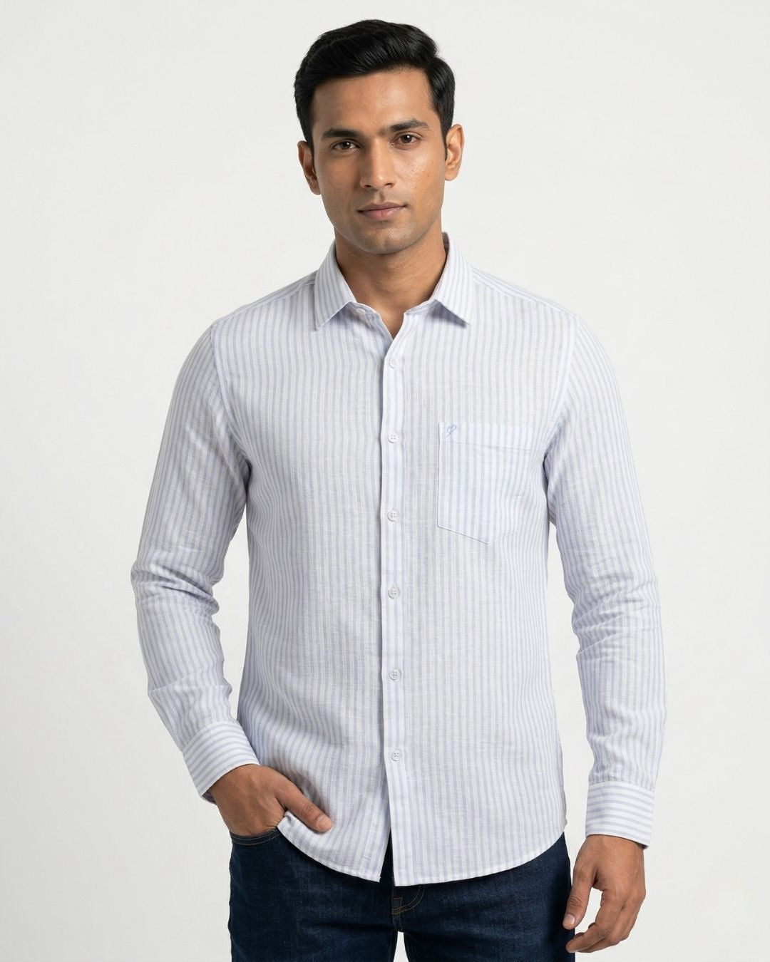 Man wearing a white and gray striped shirt on a white background