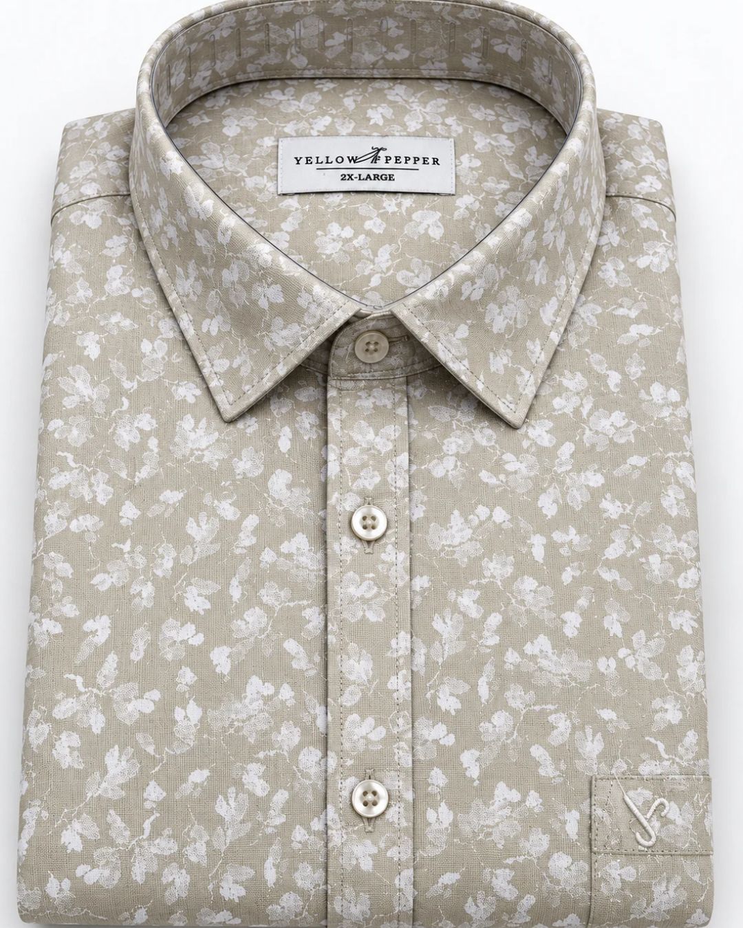 A folded long-sleeve button-up shirt by YellowFrepper, featuring a light beige and white floral pattern, a classic collar, and a button-down front.