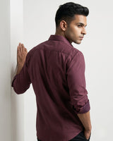 Men's maroon micro-dot long-sleeve button-down shirt with chest pocket.